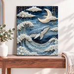 Finished whale under moon and clouds pearl diamond painting artwork displayed as home decor