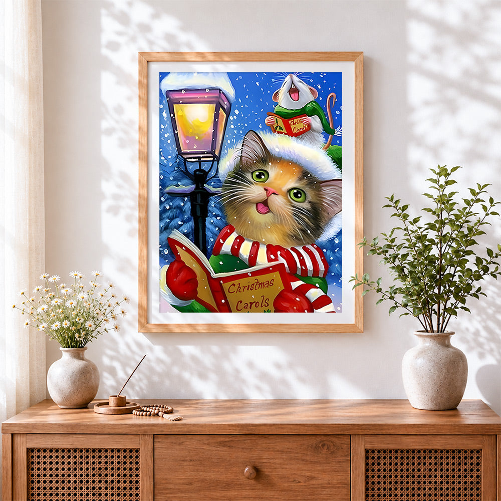 Finished whimsical cat and mouse singing christmas carols cross stitch artwork displayed