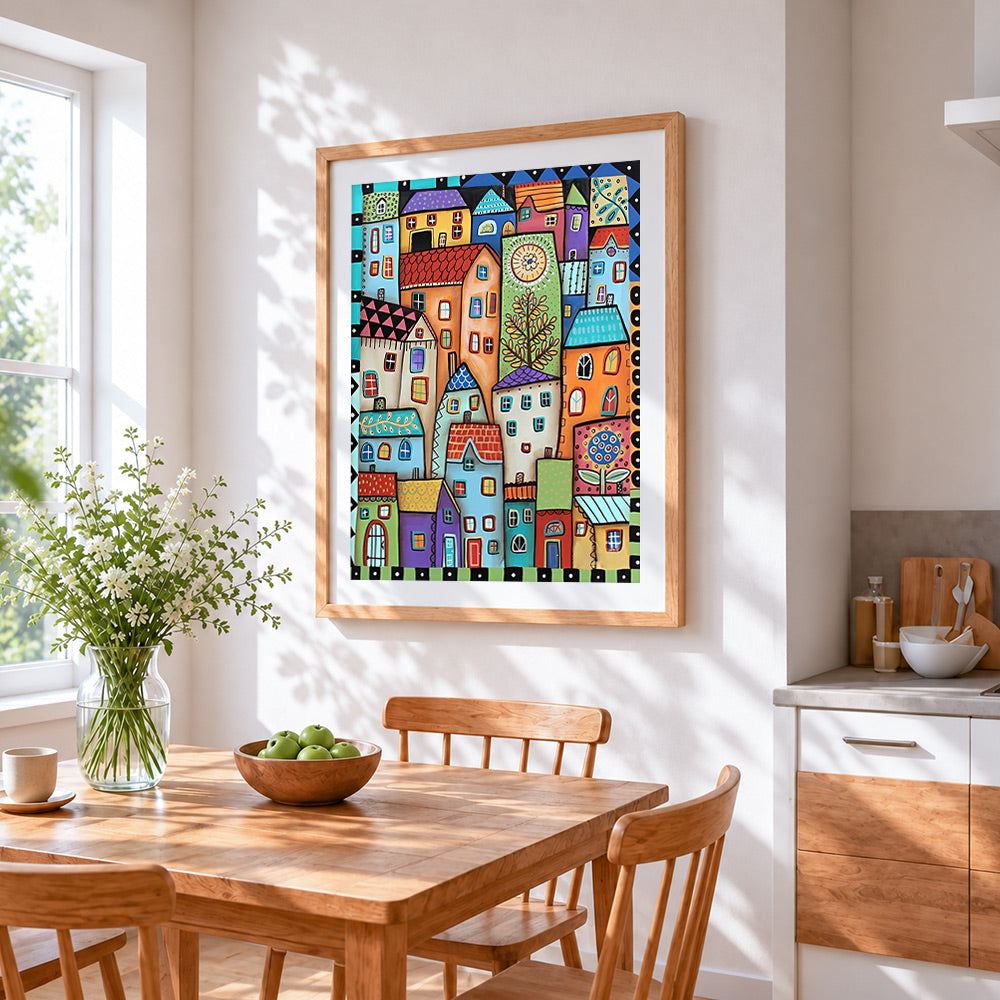 Whimsical colourful village cross stitch artwork displayed on wall as home decor