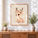 Finished whimsical deer with flower crown cross stitch artwork displayed