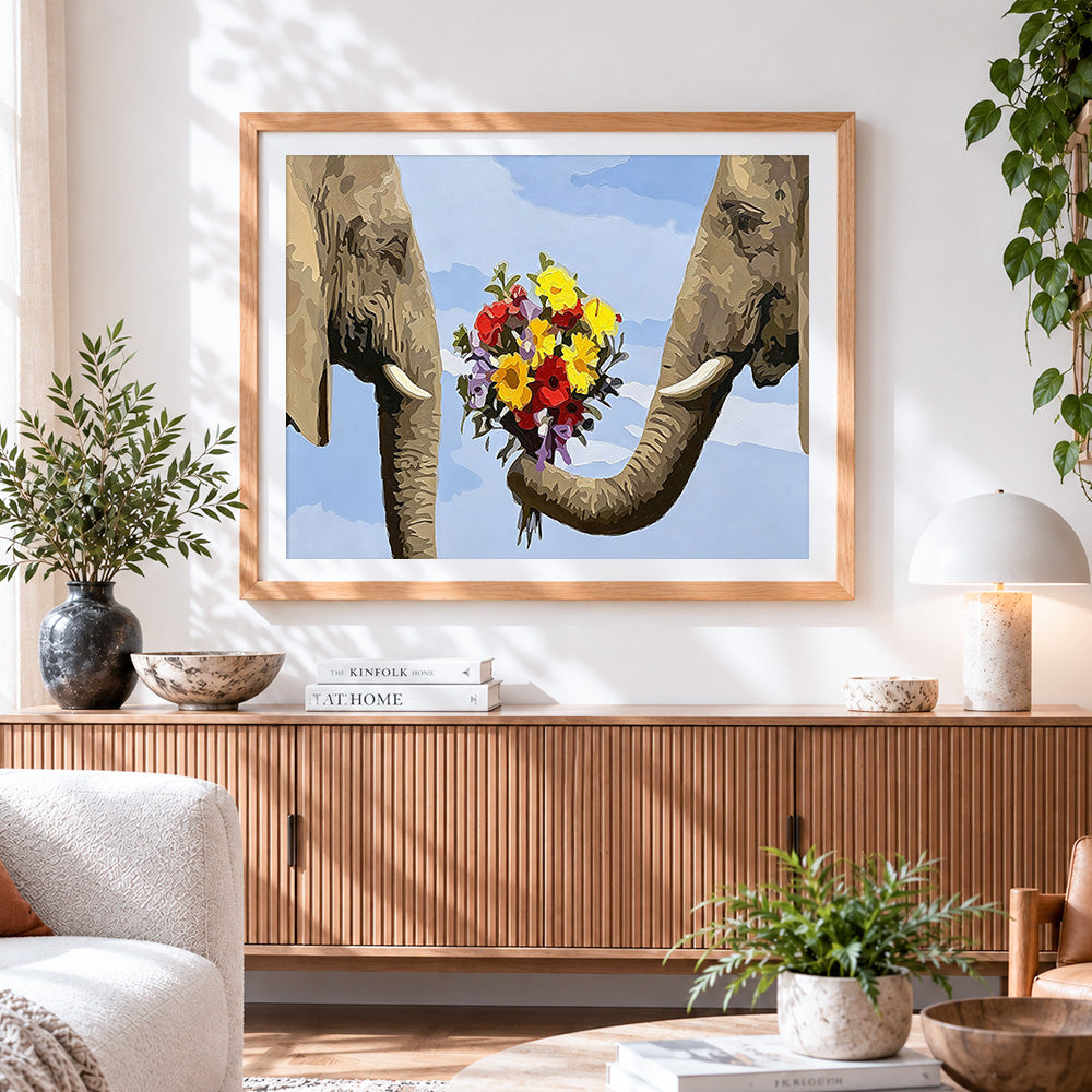 Finished whimsical elephants holding flowers cross stitch artwork displayed