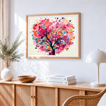 Whimsical heart shaped blossom tree cross stitch artwork displayed on wall as home decor