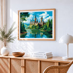 Whimsical lakeside castle cross stitch artwork displayed on wall as home decor