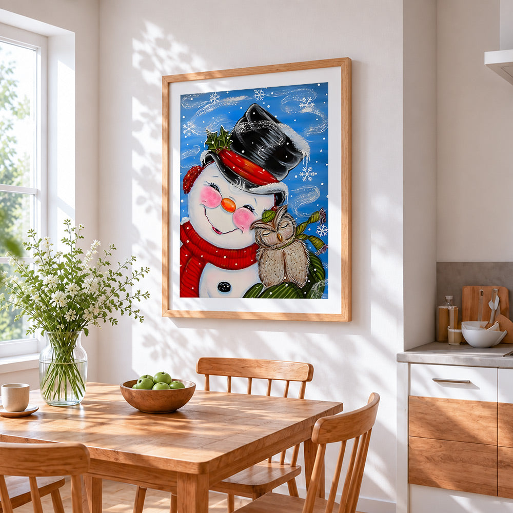 Whimsical snowman and owl in the snow cross stitch artwork displayed on wall as home decor