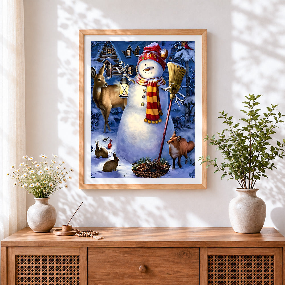 Finished whimsical snowman and woodland animals cross stitch artwork displayed