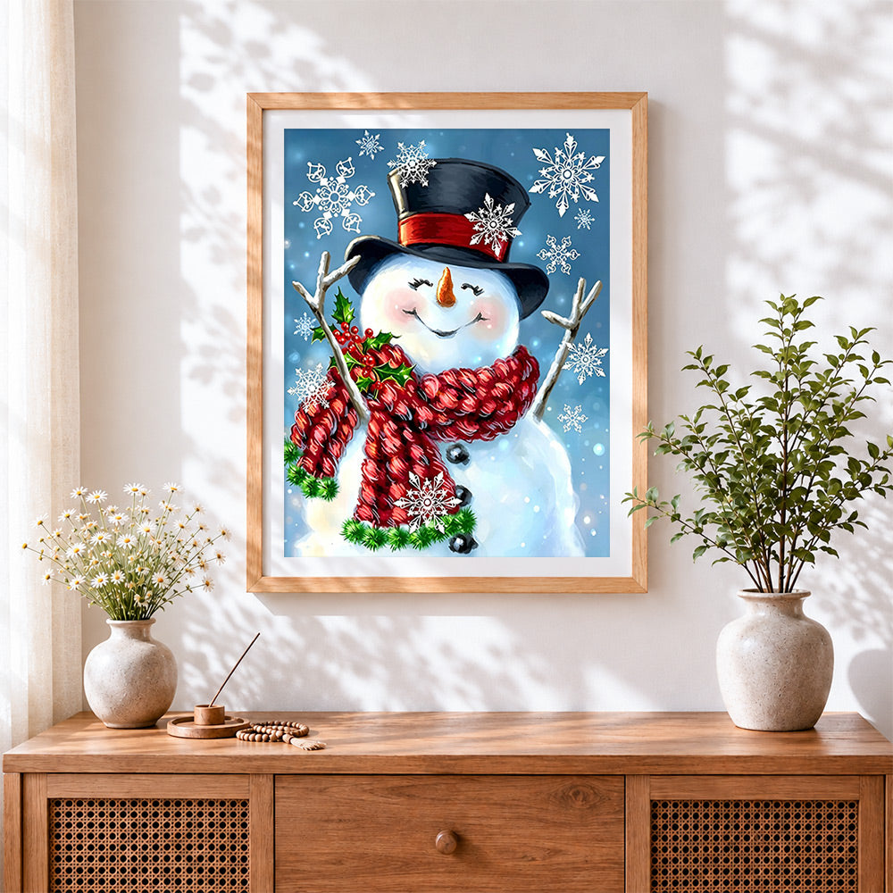 Finished whimsical snowman with snowflakes cross stitch artwork displayed