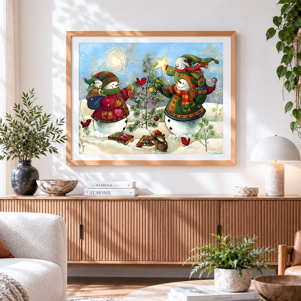 Finished whimsical snowmen decorating tree cross stitch artwork displayed