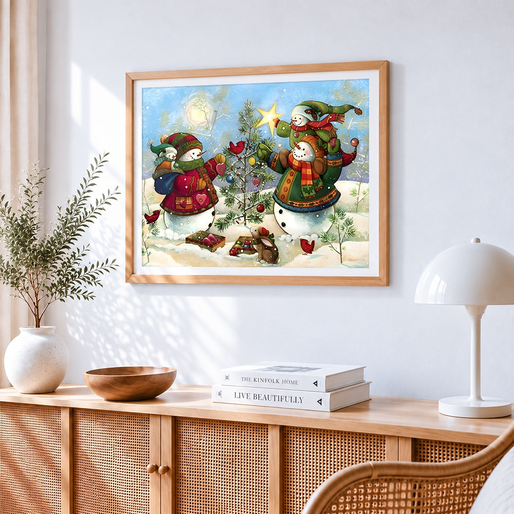 Whimsical snowmen decorating tree cross stitch artwork displayed on wall as home decor