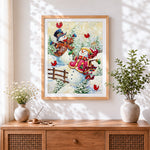 Finished whimsical snowmen in winter coats cross stitch artwork displayed
