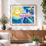 Finished whimsical space bus and smiling sun paint by numbers artwork displayed as home decor