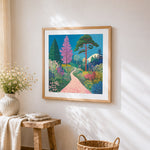 Whimsical wildflowers and path cross stitch artwork displayed on wall as home decor