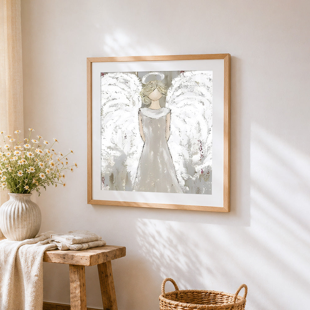White angel statue cross stitch artwork displayed on wall as home decor