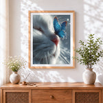 Finished white cat and blue butterfly cross stitch artwork displayed