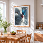 White cat and blue butterfly cross stitch artwork displayed on wall as home decor
