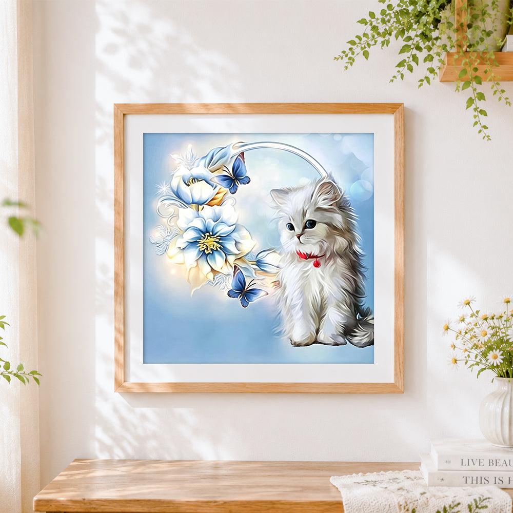 Finished white cat with blue flowers cross stitch artwork displayed