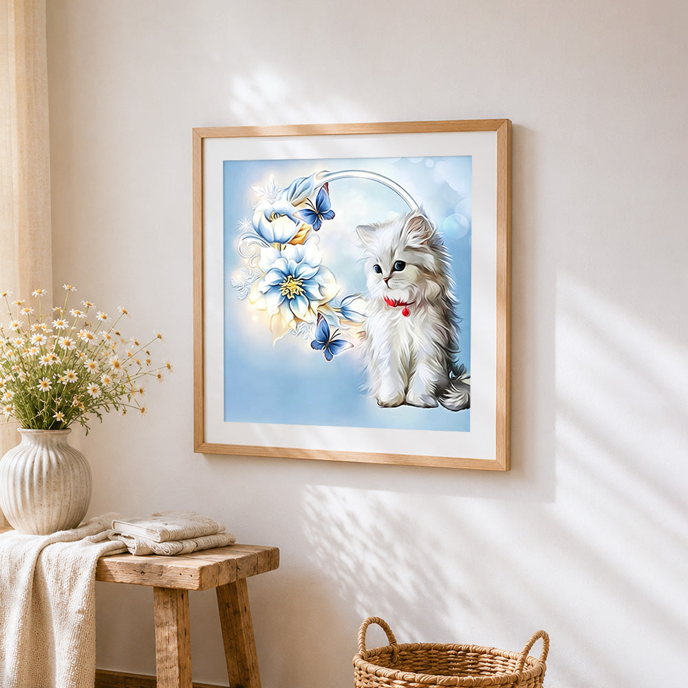 White cat with blue flowers cross stitch artwork displayed on wall as home decor