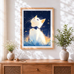 Finished white cat with bow tie looking up cross stitch artwork displayed