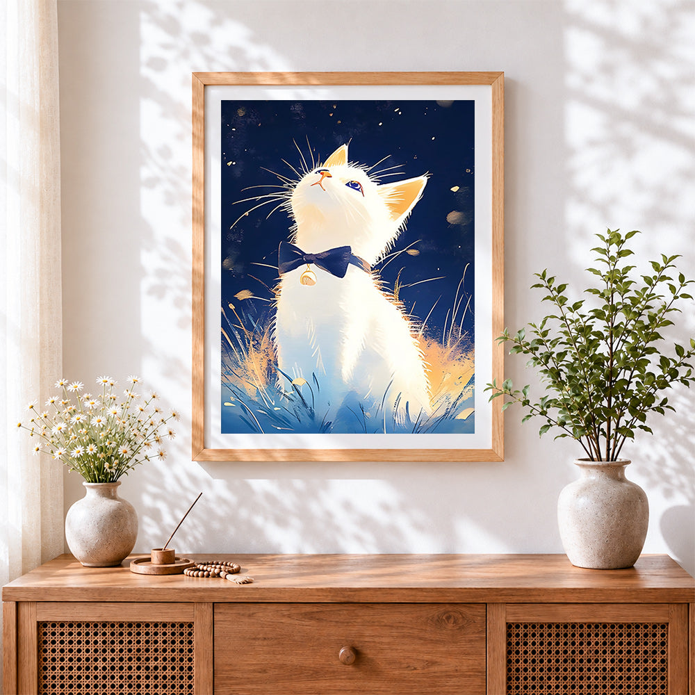 Finished white cat with bow tie looking up cross stitch artwork displayed