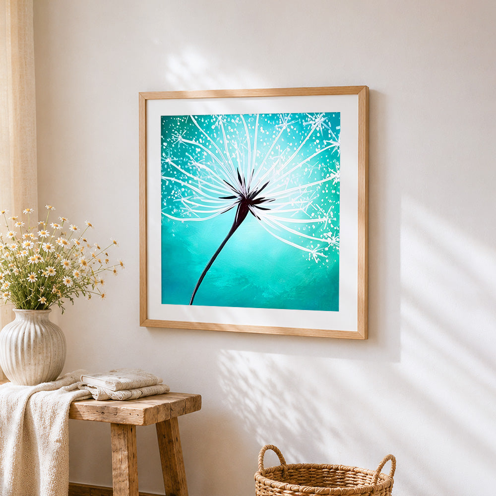 White dandelion on green background cross stitch artwork displayed on wall as home decor