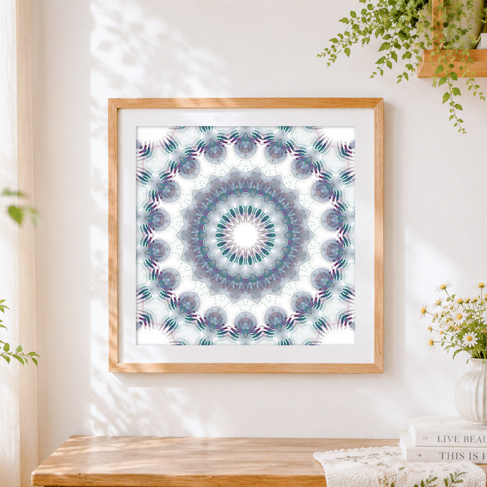 Finished white kaleidoscope mandala cross stitch artwork displayed