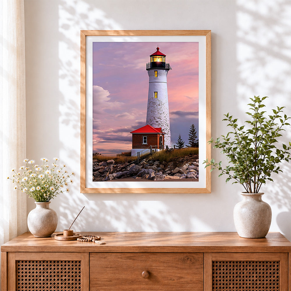 Finished white lighthouse under the pink and purple sky paint by numbers artwork displayed as home decor