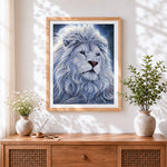 Finished white lion with blue eyes cross stitch artwork displayed