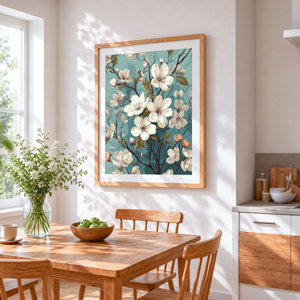 White magnolia on teal background cross stitch artwork displayed on wall as home decor