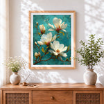Finished white magnolias on a teal background cross stitch artwork displayed