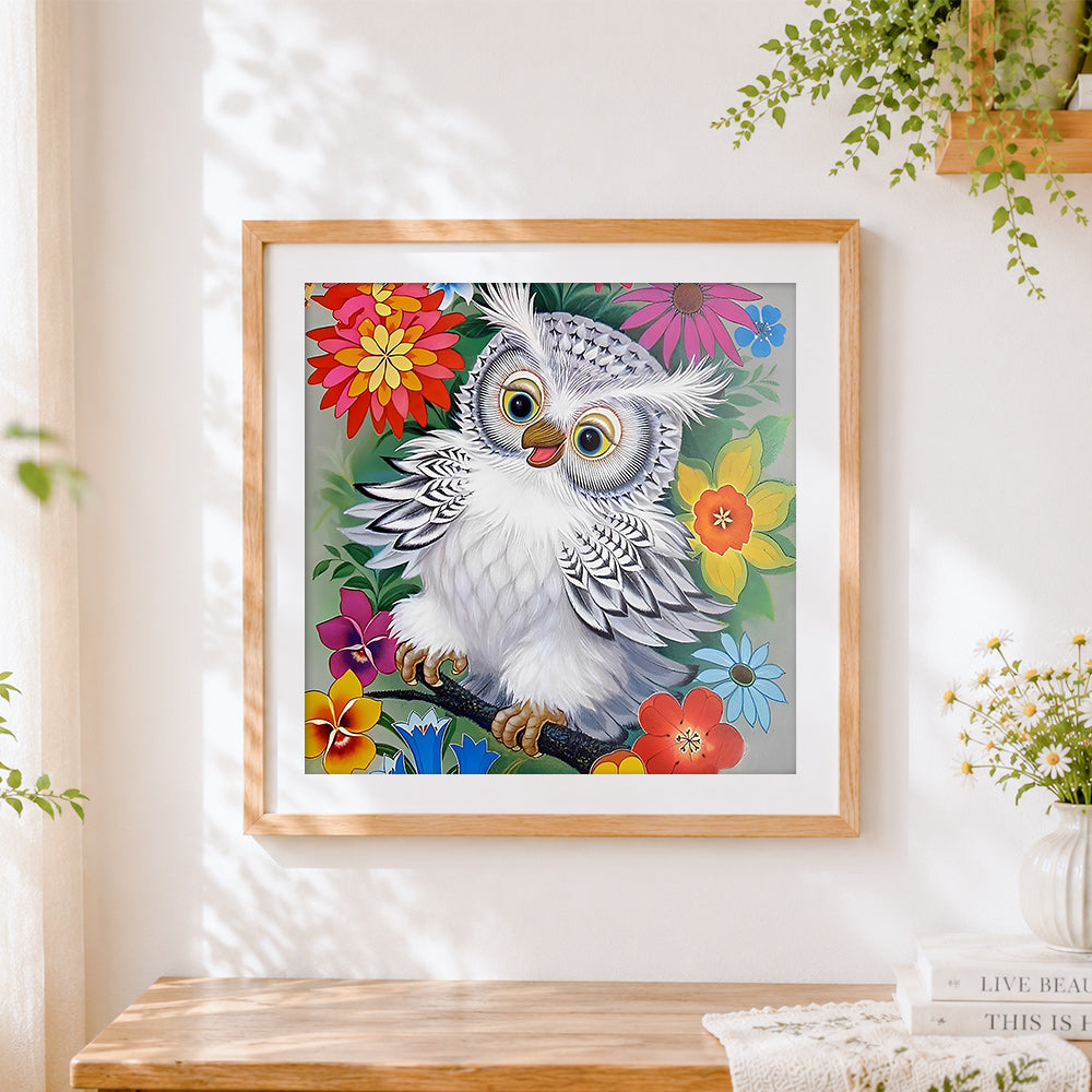 Finished white owl in colourful flowers cross stitch artwork displayed