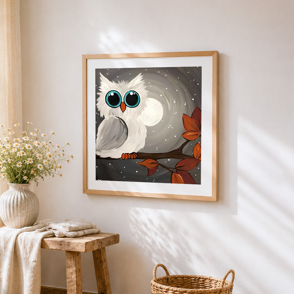 White owl in moonlight cross stitch artwork displayed on wall as home decor