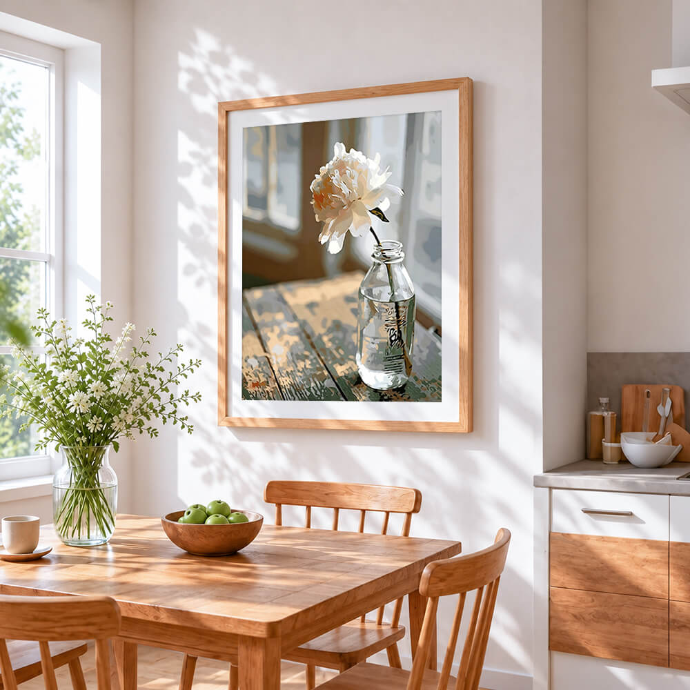 White peony in glass bottle cross stitch artwork displayed on wall as home decor