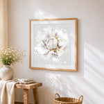 White peony with gold leaf splatter cross stitch artwork displayed on wall as home decor