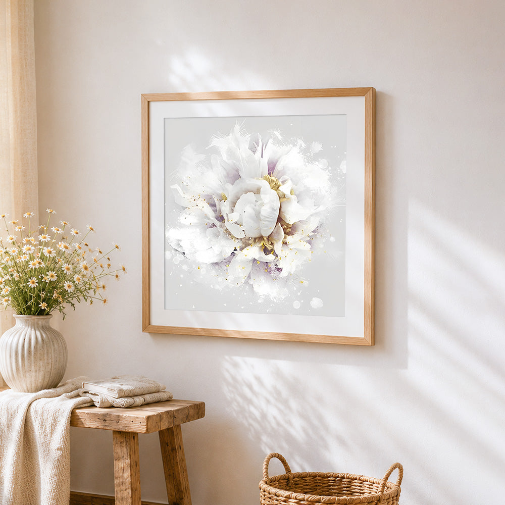 White peony with gold leaf splatter cross stitch artwork displayed on wall as home decor