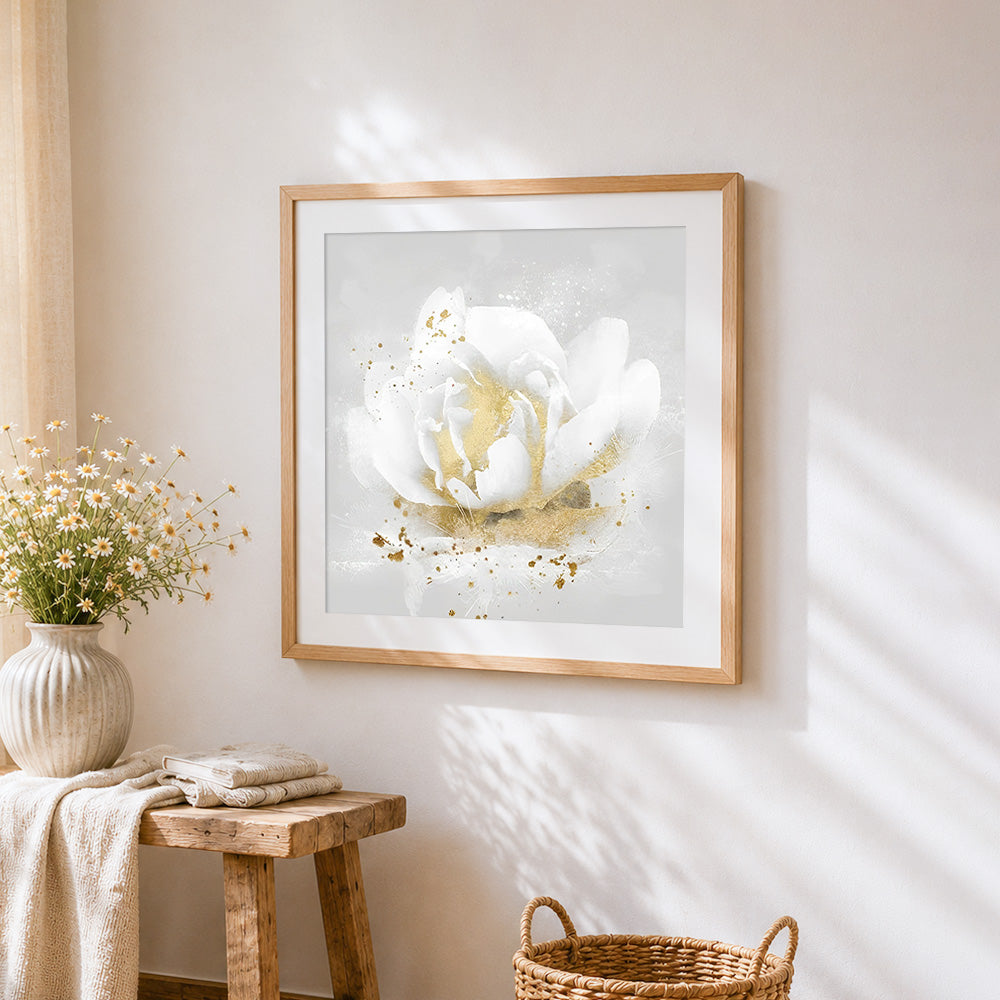 White rose with golden centre cross stitch artwork displayed on wall as home decor