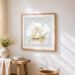 White rose with golden centre cross stitch artwork displayed on wall as home decor