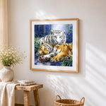 White tiger and bengal tiger in bamboo forest cross stitch artwork displayed on wall as home decor