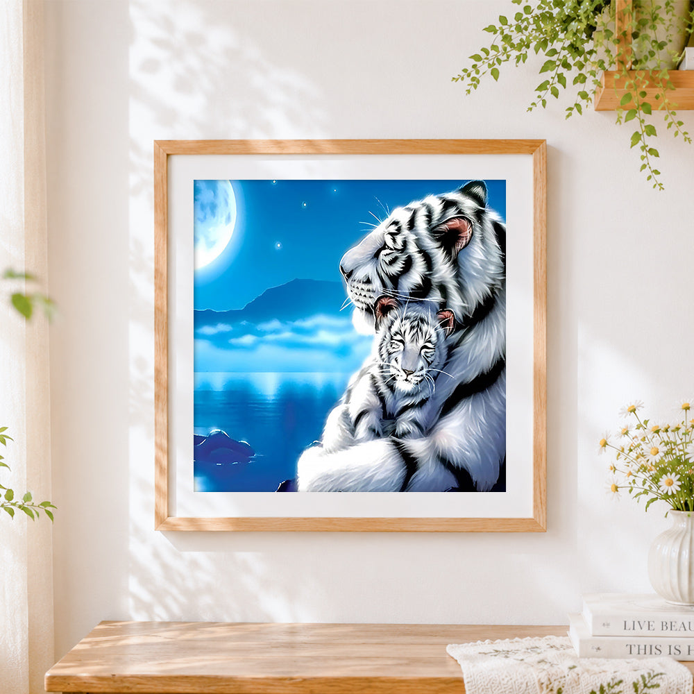 Finished white tiger and cub under the moon cross stitch artwork displayed