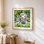 White tiger family in tropical jungle cross stitch artwork displayed on wall as home decor