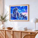 White tiger family under aurora cross stitch artwork displayed on wall as home decor