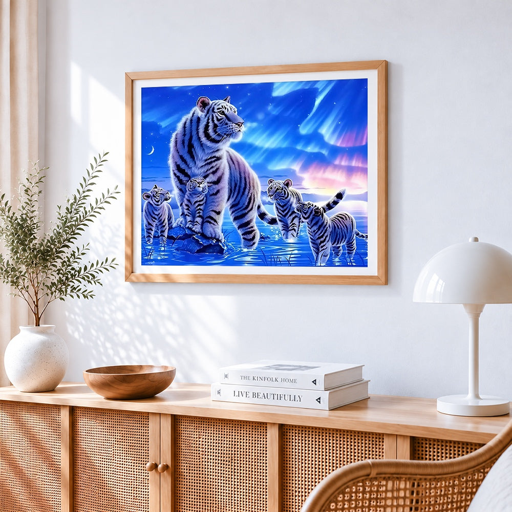 White tiger family under aurora cross stitch artwork displayed on wall as home decor