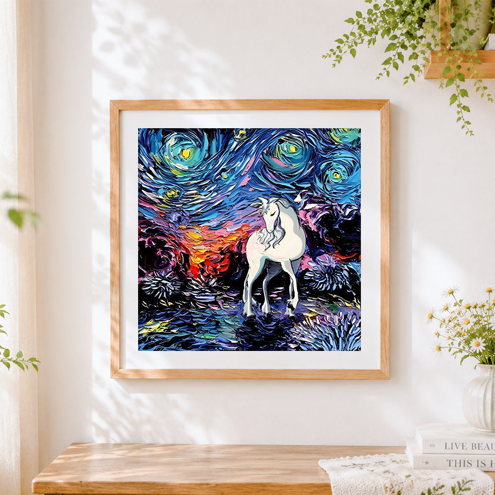 Finished white unicorn in a starry night cross stitch artwork displayed
