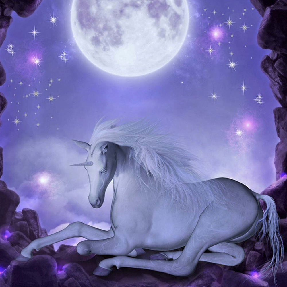 White unicorn resting under a full moon cross stitch kit for beginners