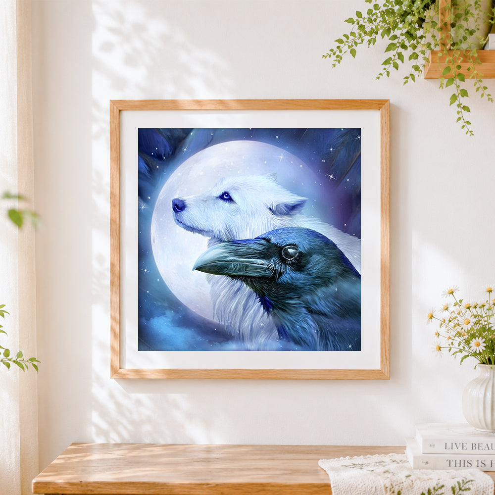 Finished white wolf and raven under a full moon cross stitch artwork displayed