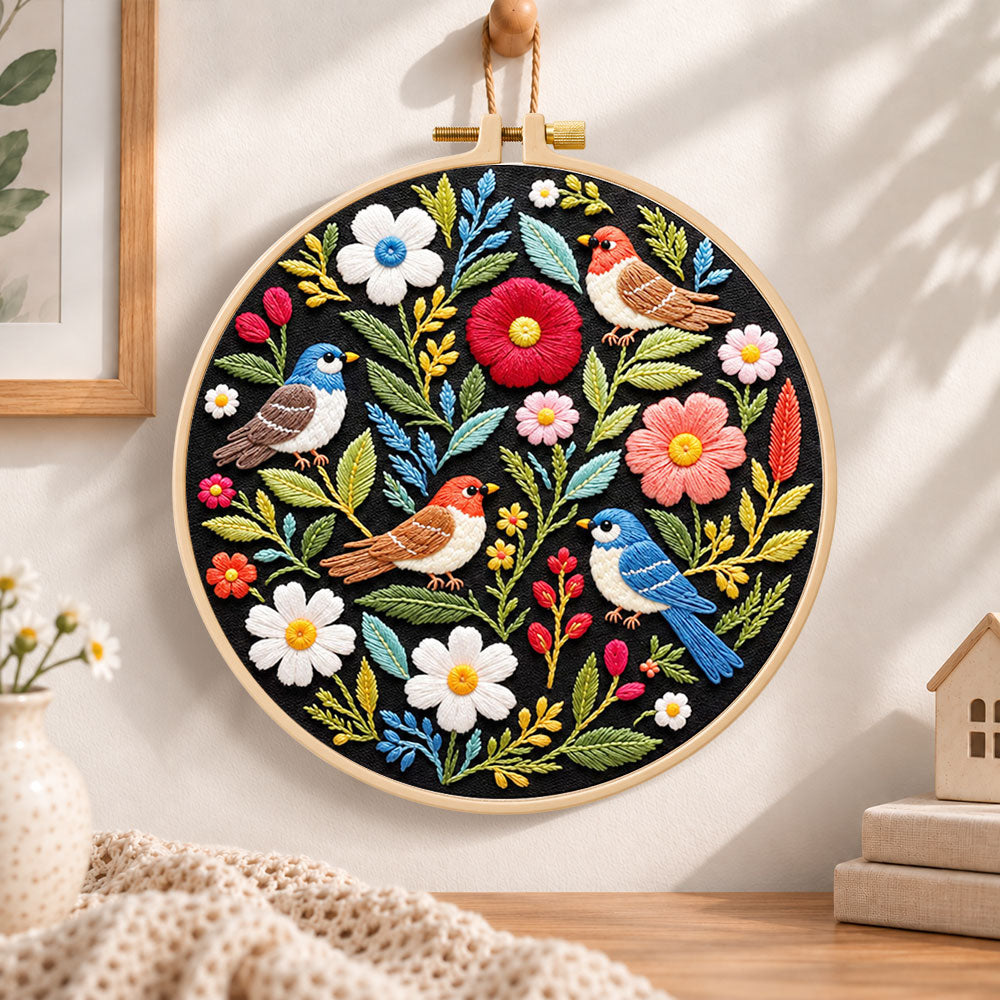 Wild birds and mixed flowers embroidery hoop wall art displayed as warm and cosy handmade home decor