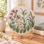 Wildflower blooms embroidery kit finished hoop displayed on a wooden stand as cosy tabletop decor