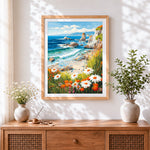 Finished wildflower cliffside and ocean waves cross stitch artwork displayed