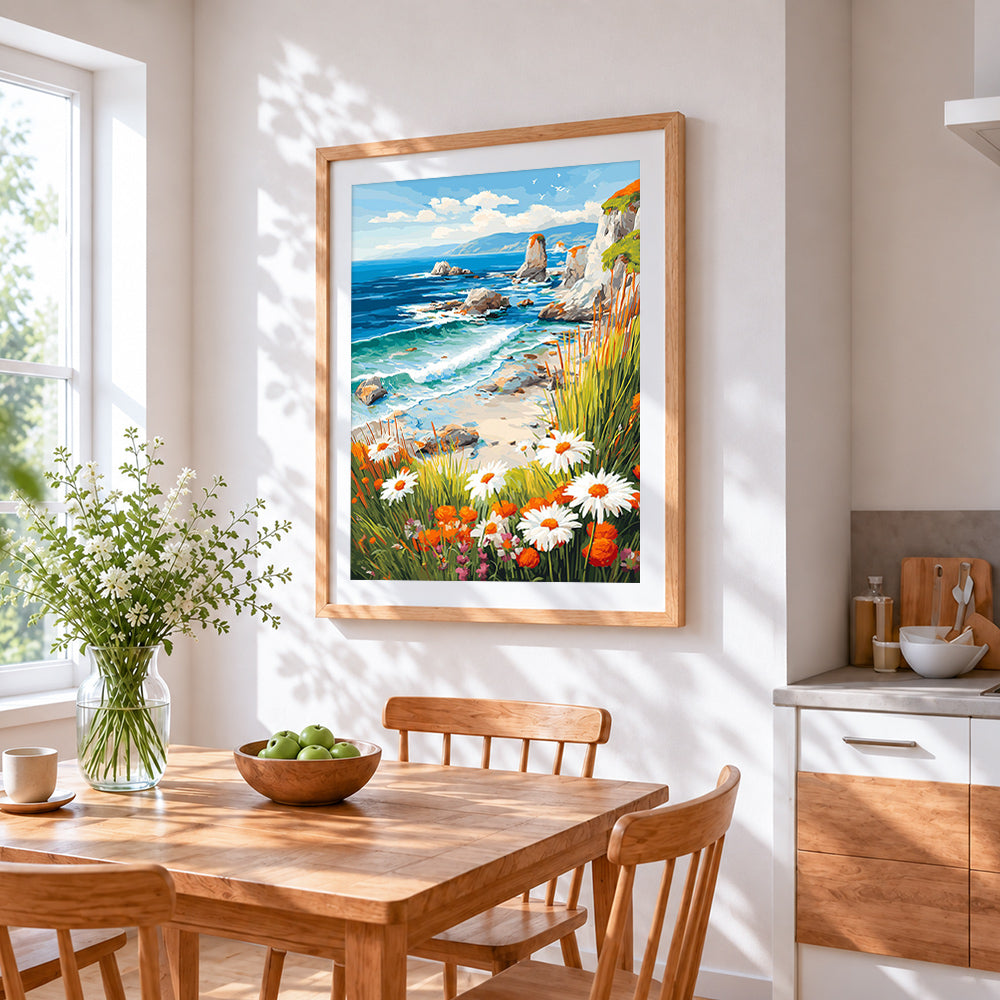 Wildflower cliffside and ocean waves cross stitch artwork displayed on wall as home decor