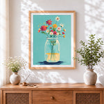 Finished wildflowers in a mason jar cross stitch artwork displayed