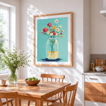 Wildflowers in a mason jar cross stitch artwork displayed on wall as home decor