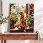 Finished windowside ginger cat pearl diamond painting artwork displayed as home decor